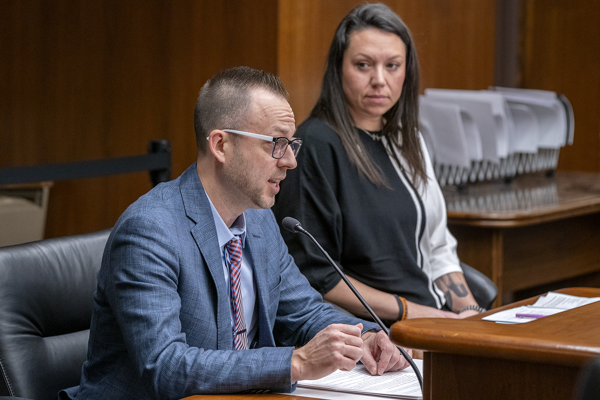 Peter Woitock, government relations specialist at Hunger Solutions Minnesota, testifies before the House Children and Families Finance and Policy Committee Feb. 20 on HF3469. Rep. Heather Keeler, right, sponsors the bill. (Photo by Michele Jokinen)